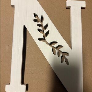 White Decorative Letter 'N' with Leaf Design
